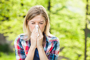 Person Blowing Their Nose